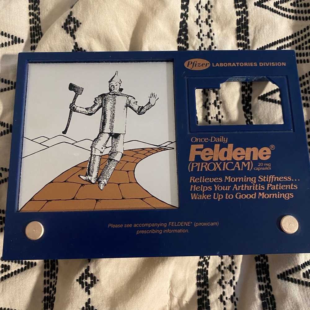 Pfizer Feldene Display with Tin Man Illustration